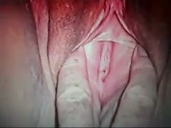 A plump white lady displays her enormous pussy while masturbating with a banana.